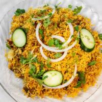 Lamb Biryani · Lamb cooked with aromatic rice and flavored with saffron.