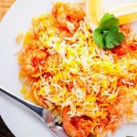 Shrimp Biryani · Shrimp cooked with basmati rice, saffron and spices.