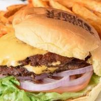 Bumper Burger · Quarter pound beef patty with lettuce, tomatoes, onions, pickles, American cheese, and our s...