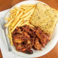 Rib Tips Dinner · One pound meaty rib tips with fries, coleslaw and a fresh baked Amicci mini loaf.