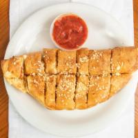 Pepperoni Bread · Freshly baked bread strips stuffed with pepperoni and covered with Parmesan cheese and garli...