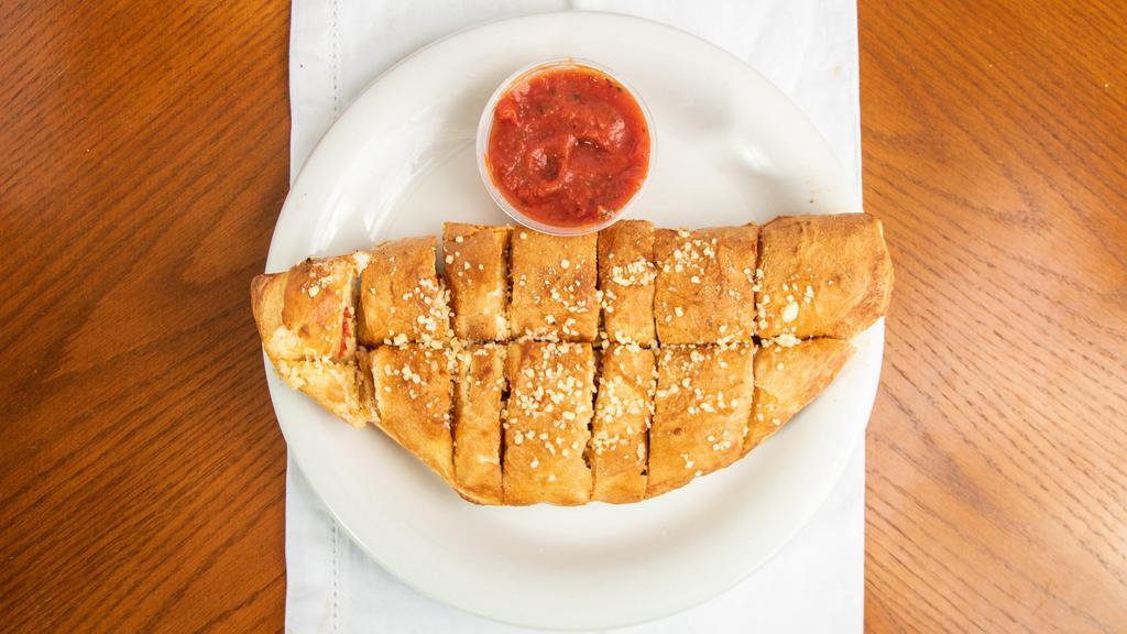Pepperoni Bread (Large 16 Pcs.) · Freshly baked bread strips stuffed with pepperoni and covered with Parmesan cheese and garlic butter.
