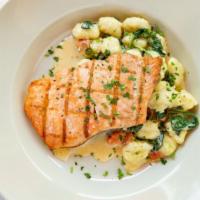 Salmone Piccata · Grilled Atlantic salmon, lemon-caper butter sauce, roasted potatoes, artichokes, spinach, an...