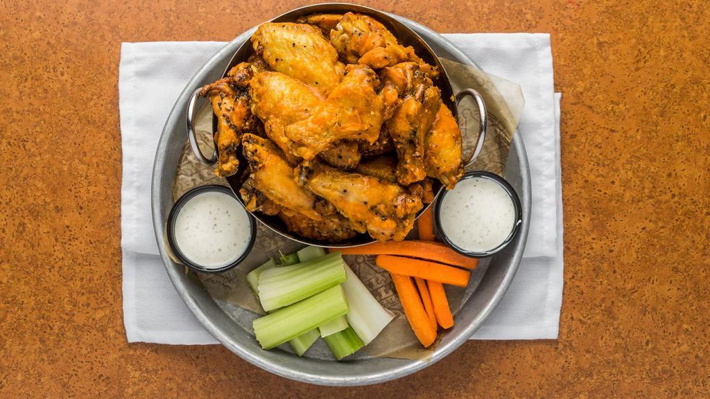 Traditional · Traditional bone-in wings tossed in your favorite sauce or dry rub.