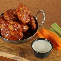 Boneless · Traditional bone-in wings tossed in your favorite sauce or dry rub.