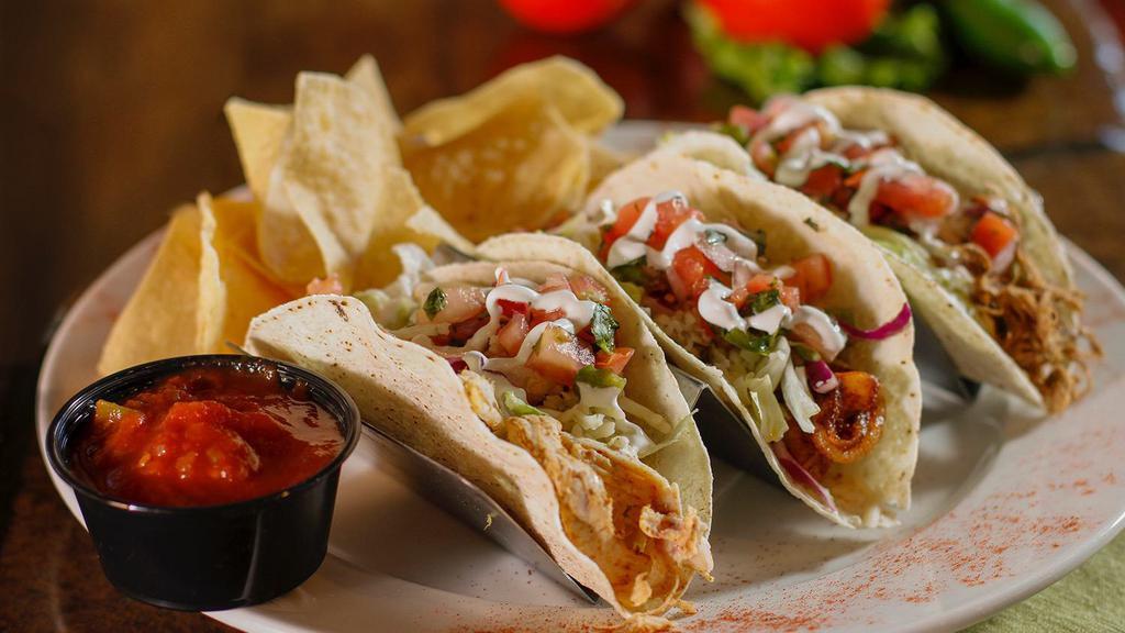 Chipotle Lime Chicken Tacos* · Slow-roasted chicken seasoned with our special chipotle essence and finished with Monterey Cheddar Jack cheese.