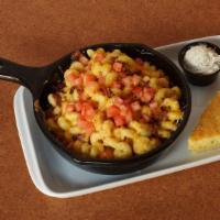 House Mac · Made from scratch cheese sauce tossed in cavatappi noodles, topped with shredded Monterey Ch...