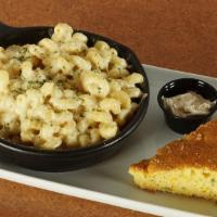 Smokey Gouda Mac* · Hearty cavatappi noodles tossed in our smoked gouda sauce and topped with a savory blend of ...