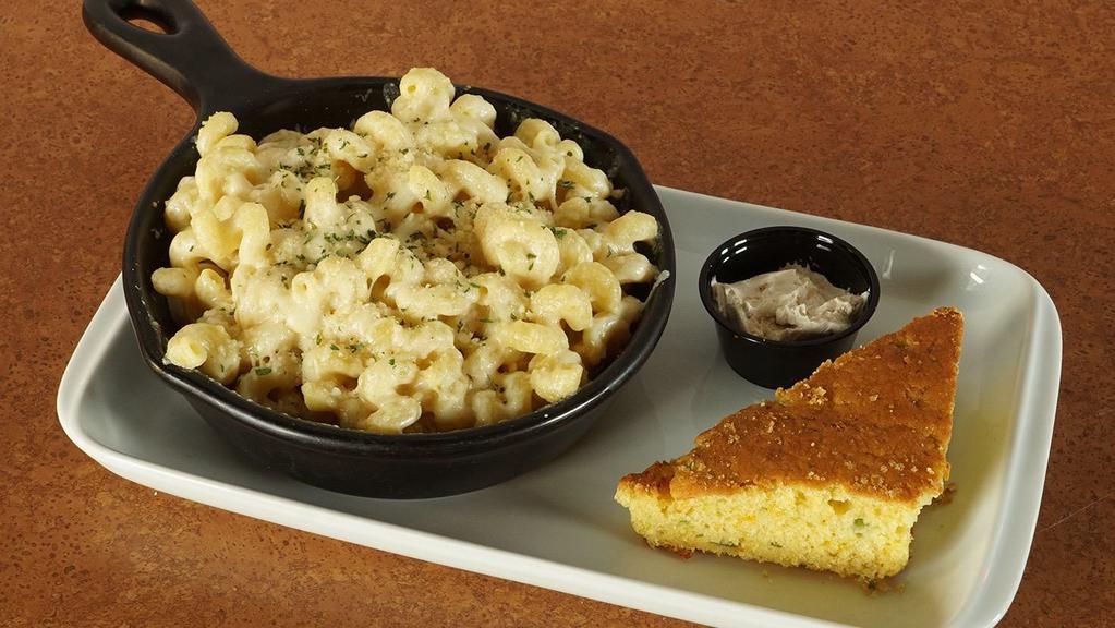 Smokey Gouda Mac* · Hearty cavatappi noodles tossed in our smoked gouda sauce and topped with a savory blend of imported asiago and parmesan cheese then finished in the oven to a warm and bubbly crusted top.