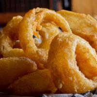 Beer Battered Onion Rings · Double-dipped in craft bent arm ale and fried to crispy deliciousness. Served with wild bill...
