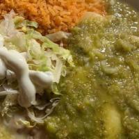 Enchiladas Suizas  · 3 Chicken Enchiladas topped with green salsa, cheese, and sour cream. Served with rice and b...
