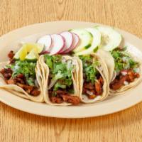 Taco (Maíz/Corn) · Served with onion, cilantro, and lime. You can add grilled onion and pepper if you would lik...
