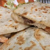Quesadilla  · Served with rice, beans, and salad.  Please choose meat option and you can add shrimp if you...