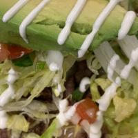 Tostada · Served with rice and beans. Please choose meat option for topping. Topping include beans, ch...