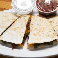 Fajita Quesadilla · Flour tortilla stuffed with cheddar & jack cheeses, bell peppers, onions & your choice of st...