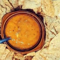 Queso Dip · A mouth-watering three cheese blend with seasoned ground beef & fresh homemade salsa. Served...