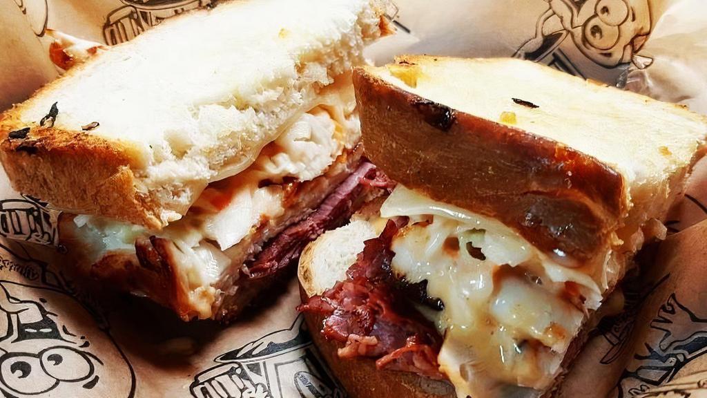 Dinty Moore · Eastern Market’s Famous Grobbel’s Corned Beef, turkey, swiss cheese, coleslaw & house sauce, served on grilled deli rye