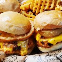Bbq Chicken Sliders · Seasoned hand-shredded chicken tossed in bbq sauce, topped with onion rings & cheddar cheese...