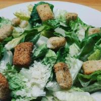 Caesar Salad · Bed of crisp romaine, topped with parmesan cheese & croutons, served with Caesar dressing on...
