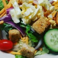 Side Salad · Romaine lettuce topped with shredded cheddar, egg, red onion, cucumber, tomato & croutons