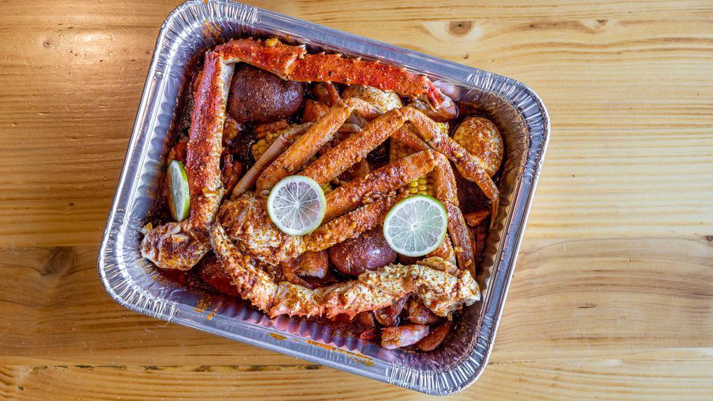 Fire Bird For Two · Half pound king crab, 1 Clusters of snow crab, half pound shrimp (no head) and half pound sausage with two corn, two potatoes and two eggs.