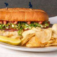 Italian Grinder · Cured Ham, Genoa Salami, Pepperoni smothered in Mozzarella and garnished with Lettuce, Tomat...