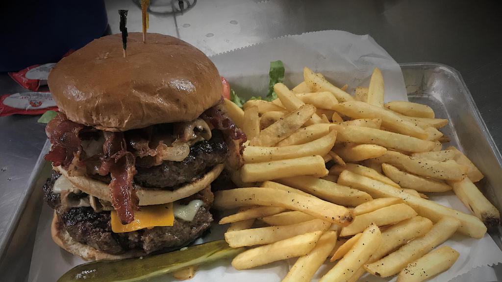 1/2# Burger · Our half pound patty seared with lettuce, tomato and onion.