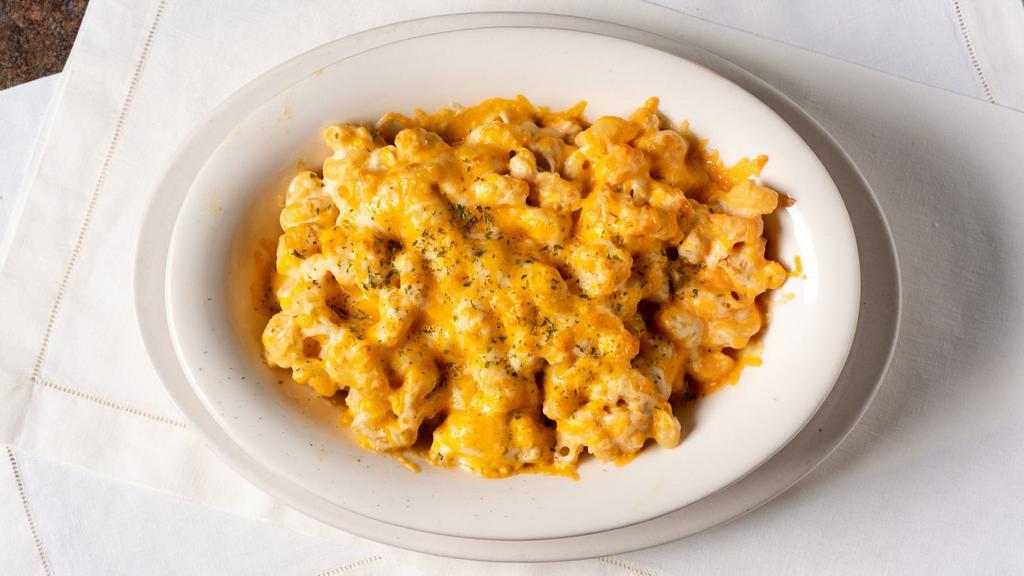Baked Mac & Cheese · Cavatappi pasta tossed in creamy mac sauce, baked with cheddar and Jack cheese and topped with potato crumbles.