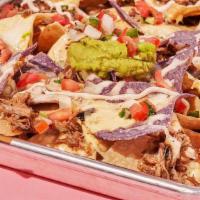 House Nachos · Chips topped with your choice of protein, queso, melted jack cheese, pico de gallo, and hous...