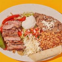 Fajita Plate · Your choice of protein, grilled peppers and onions, melted jack cheese. Served with pico de ...