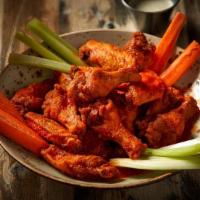Signature Hot Wings · Wings tossed in Cajun sauce and butter. Deep friend, not breaded.  Extra hot is en fuego (ha...