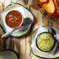 Chips & Guac · Tortilla chips served with our homemade salsa and Guacamole.   Gluten Free.