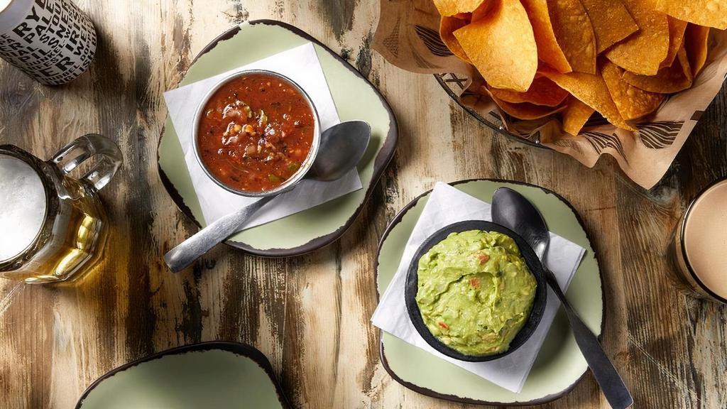 Chips & Guac · Tortilla chips served with our homemade salsa and Guacamole.   Gluten Free.