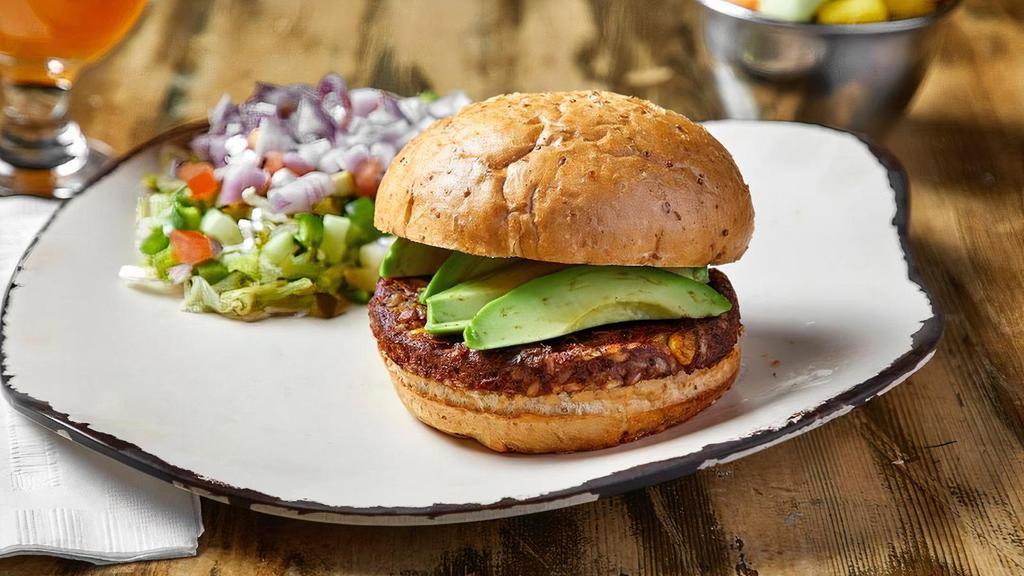 Veggie Burger · 5oz organic veggie patty topped with avocado and fresh veggie relish (lettuce, tomato, green pepper, red onion, pickle and cucumber all chopped up) on a whole wheat bun. Served with fruit.