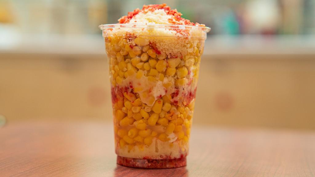 Elote Enchilado · Corn in a cup topped with hot chip, butter, mayo, and parmesan cheese