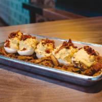 Deviled Eggs · (5 ea) Mayo, Mustard, Spices, Bacon. on a bed of Crispy Jalapeños & Onions