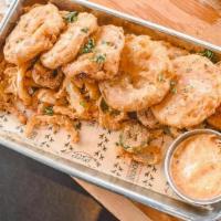 Fried Green Tomatoes · Hand-breaded, Green Tomatoes served w. Fried Jalapeños, Onions, & Southwest Remoulade.