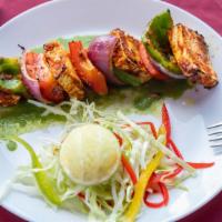 Chettinad Paneer Kabab · Cheese marinated in special spice blend from Tamil nadu is baked in a fiery hot clay oven.