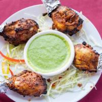 Tangdi Kabab · Juicy chicken legs marinated in a house spice blend and baked in a clay oven.