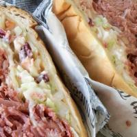 Liberty · Hot corned beef, coleslaw, Swiss cheese, & Russian dressing on onion roll.