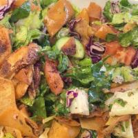 Fattoush Salad · Romaine lettuce,  tomatoes, cucumbers, onions, pita chips. house dressing.