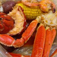 Combo E · One lobster tail, 1/2 pound shrimp (no head) and 1/2 pound snow crab.