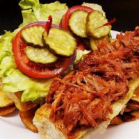 Pulled Pork · Tender hand pulled pork basted in our BBQ sauce served on a toasted roll.