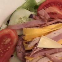 Julienne Salad - Small · Fresh lettuce topped with sliced turkey, ham, Swiss & American cheeses, with tomato, cucumbe...