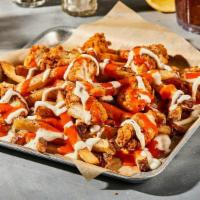 Buffalo Chicken Ranch Fries · Fresh-Cut Fries seasoned with salt and pepper. Loaded with . tangy buffalo sauce, boneless c...