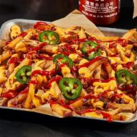 Diablo Fries · HOT HOT HOT! Fresh-Cut Fries seasoned with salt and pepper. Loaded with hot-golden cheese, b...
