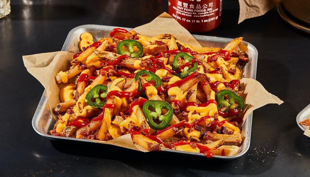 Diablo Fries · HOT HOT HOT! Fresh-Cut Fries seasoned with salt and pepper. Loaded with hot-golden cheese, bacon, Sriracha sauce and fresh jalapeños