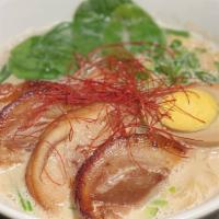 Tonkotsu Ramen · Japanese Noodles in thick Chicken broth, Pork Belly, Vegetables, and hard-boiled egg.