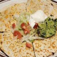 Special Quesadilla · Grilled chicken or steak 8 inch tortilla served with lettuce, tomatoes, guacamole, and sour ...