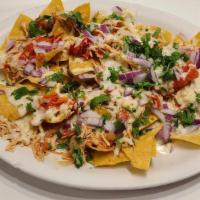 Nachos  · corn tortilla chips topped with your choice of protein
chicken, Beef, or beans  with cheese ...